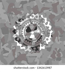 nuclear, radioactive icon inside grey camouflage texture