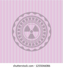 nuclear, radioactive icon inside pink emblem