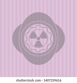 nuclear, radioactive icon inside pink emblem