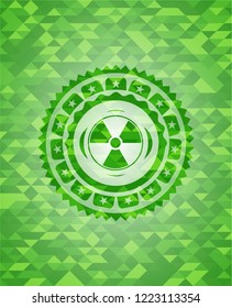 nuclear, radioactive icon inside realistic green emblem. Mosaic background