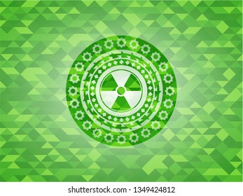 nuclear, radioactive icon inside realistic green emblem. Mosaic background