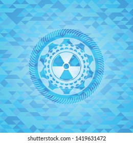 nuclear, radioactive icon inside realistic light blue emblem. Mosaic background