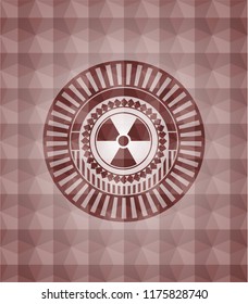 nuclear, radioactive icon inside red seamless emblem with geometric pattern background.