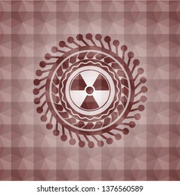 nuclear, radioactive icon inside red seamless badge with geometric pattern background.