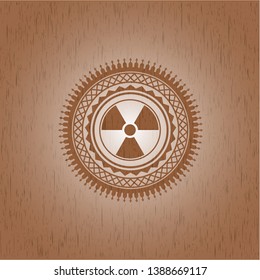 nuclear, radioactive icon inside retro wooden emblem