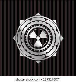 nuclear, radioactive icon inside silver badge or emblem