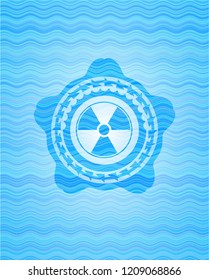 nuclear, radioactive icon inside sky blue water badge.