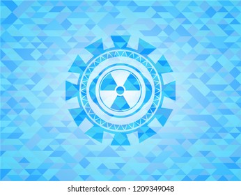 nuclear, radioactive icon inside sky blue emblem with mosaic background
