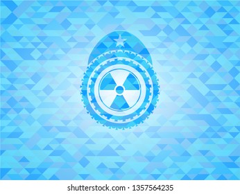 nuclear, radioactive icon inside sky blue emblem with mosaic background