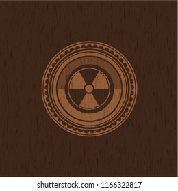 nuclear, radioactive icon inside wood badge or emblem