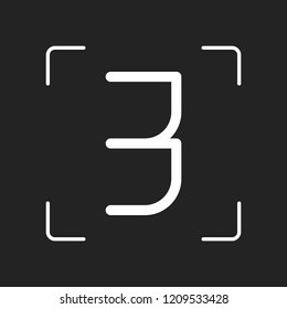 Number 3, numeral, three. White object in camera autofocus on dark background