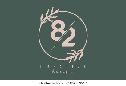 Number 82 8 2 Logo with circle frame and pastel leaves design. Rounded vector illustration with pastel leaf for beauty, fashion, jewelry, luxury, natural products or eco services.