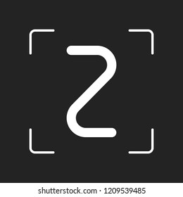 Number two, numeral, simple letter. White object in camera autofocus on dark background
