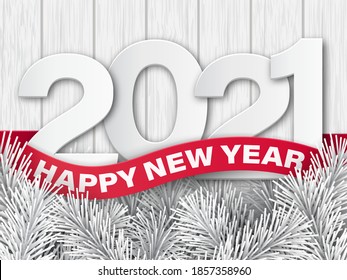 Numbers 2021 on a white, wooden background and a red ribbon with the text Happy New Years.