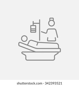 Nurse attending a patient lying on the bed line icon for web, mobile and infographics. Vector dark grey icon isolated on light grey background.