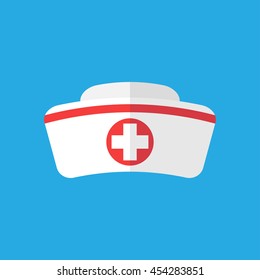 Nurse hat with cross isolated on blue background. Flat icon. Nurse hat closeup