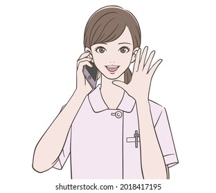 Eine Krankenschwester, die ein Smartphone hält und anruft