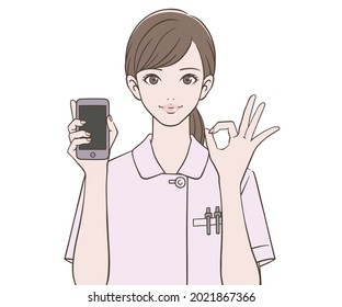 A nurse holding a smartphone and making an ok mark