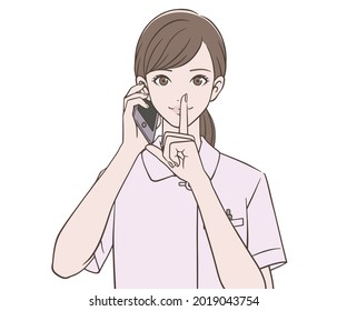 A nurse holding a smartphone and putting her index finger on her mouth