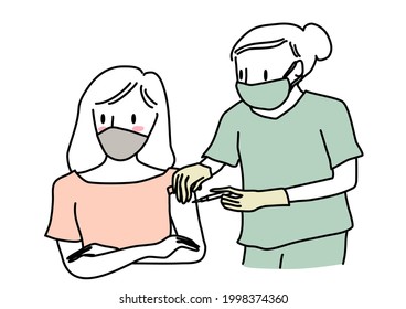 Nurse Injecting Woman With A Dose Of Vaccine. Female Patient Receiving A Shot Of Vaccine From Nurse. Healthcare Worker With Face Mask Giving Girl Patient A Dose Of Vaccine. People Getting Vaccine.