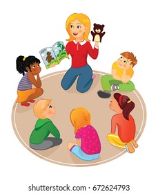 Nursery or elementary school teacher reading a book to kids and show puppet in school, preschool or kindergarden. Kids listening to a storybook.