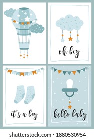 Nursery hand drawn illustration set. Air balloon, clouds and stars, baby clothes, calligraphy it’s a boy, hello baby. Childish print for baby shower, greeting card, nursery poster, invitation, t-shirt