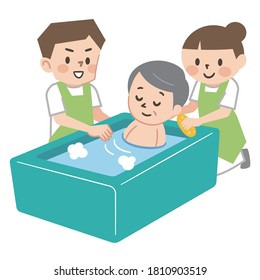 Nursing staff assisting the elderly bathing