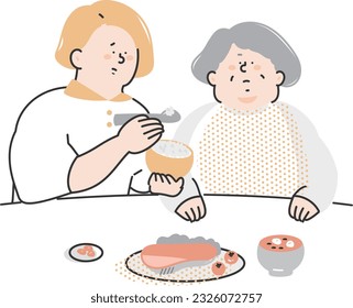 Nursing staff assisting the elderly with meals