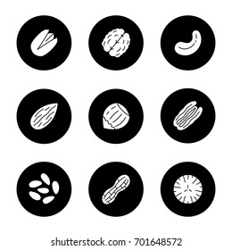 Nuts types glyph icons set. Pistachio, walnut, cashew and pecan nuts, almond, hazelnut, pinenuts, peanut, nutmeg. Vector white silhouettes illustrations in black circles