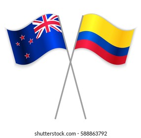 NZ and Colombian crossed flags. New Zealand combined with Colombia isolated on white. Language learning, international business or travel concept.