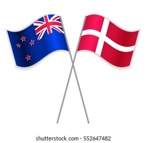 NZ and Danish crossed flags. New Zealand combined with Denmark isolated on white. Language learning, international business or travel concept.