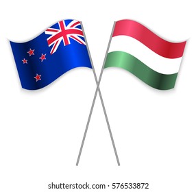 NZ and Hungarian crossed flags. New Zealand combined with Hungary isolated on white. Language learning, international business or travel concept.