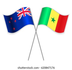 NZ and Senegalese crossed flags. New Zealand combined with Senegal isolated on white. Language learning, international business or travel concept.