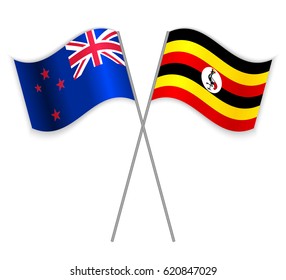 NZ and Ugandan crossed flags. New Zealand combined with Uganda isolated on white. Language learning, international business or travel concept.