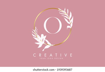 O Letter logo design with golden circles and white leaves on branches around it. Vector Illustration with O letter for personal branding, corporate, business, eco friendly or natural products. 