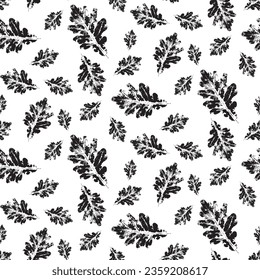 Oak leaf stamp print seamless pattern. Grunge autumn leaves imprints. Ink floral texture. Objects isolated on white. Black and white vector illustration.