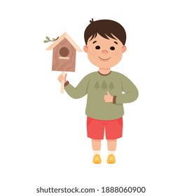 Obedient Boy with Good Breeding Holding Wooden Bird House Vector Illustration