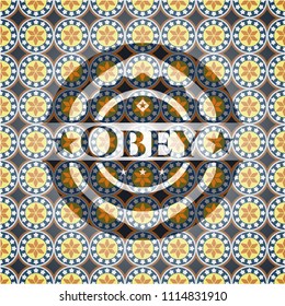 Obey arabic badge. Arabesque decoration.