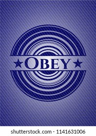 Obey badge with denim background