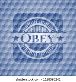 Obey blue badge with geometric pattern background.