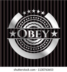 Obey silver emblem or badge