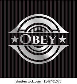 Obey silver emblem or badge