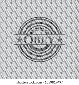 Obey silver shiny badge. Scales pattern. Vector Illustration. Detailed.