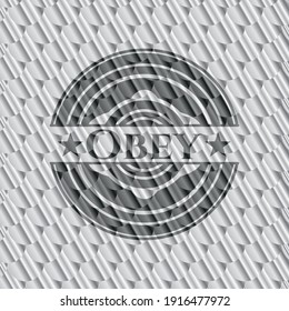 Obey silver shiny emblem. Scales pattern. Vector Illustration. Detailed. 