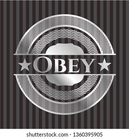 Obey silvery badge