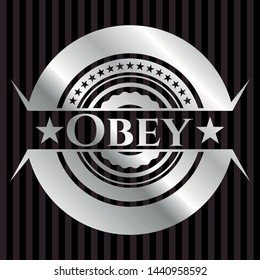  Obey silvery badge or emblem. Vector Illustration. Mosaic.