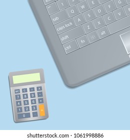 Object laptop and calculator on blue background