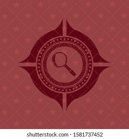 [object Omagnifying glass icon inside red emblembject]