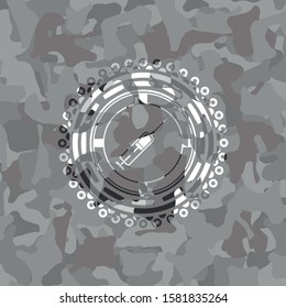 [object Osyringe icon inside grey camouflage emblembject]