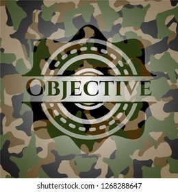 Objective written on a camouflage texture